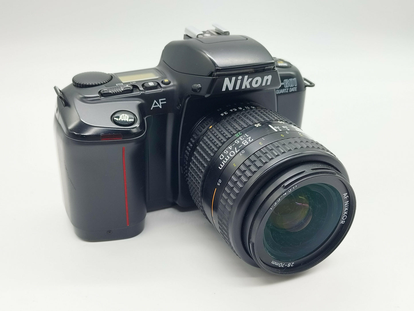 Nikon F601 autofocus film camera + 28-70mm zoom lens.
