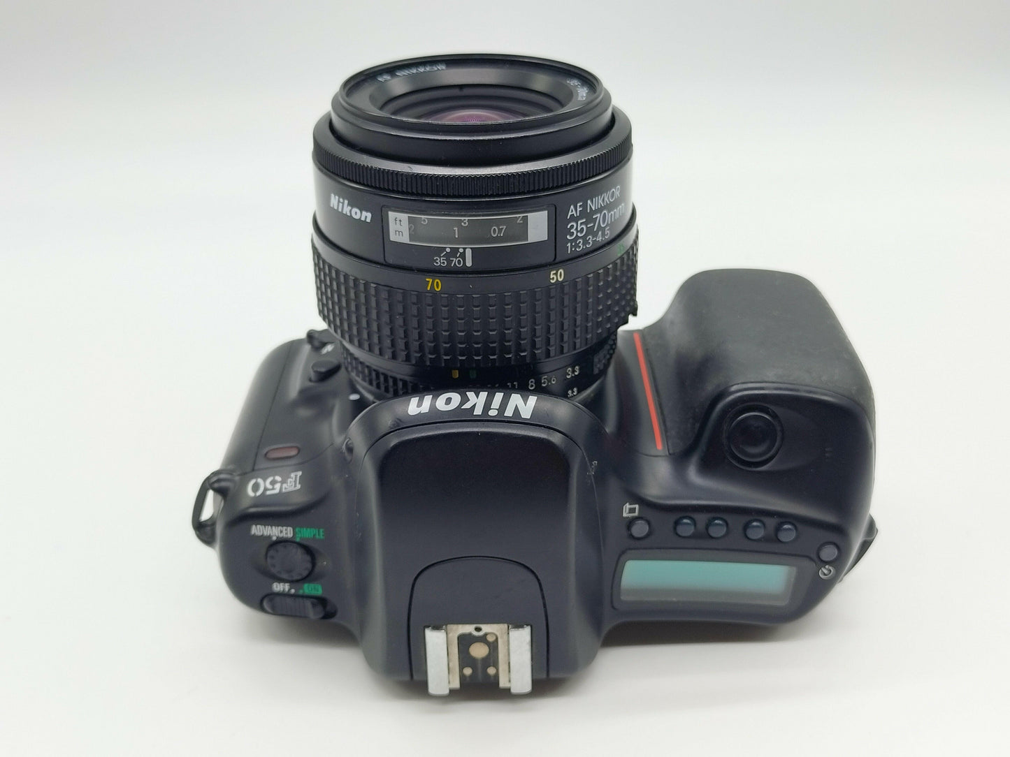Nikon F50 autofocus film camera + 35-70mm zoom lens.