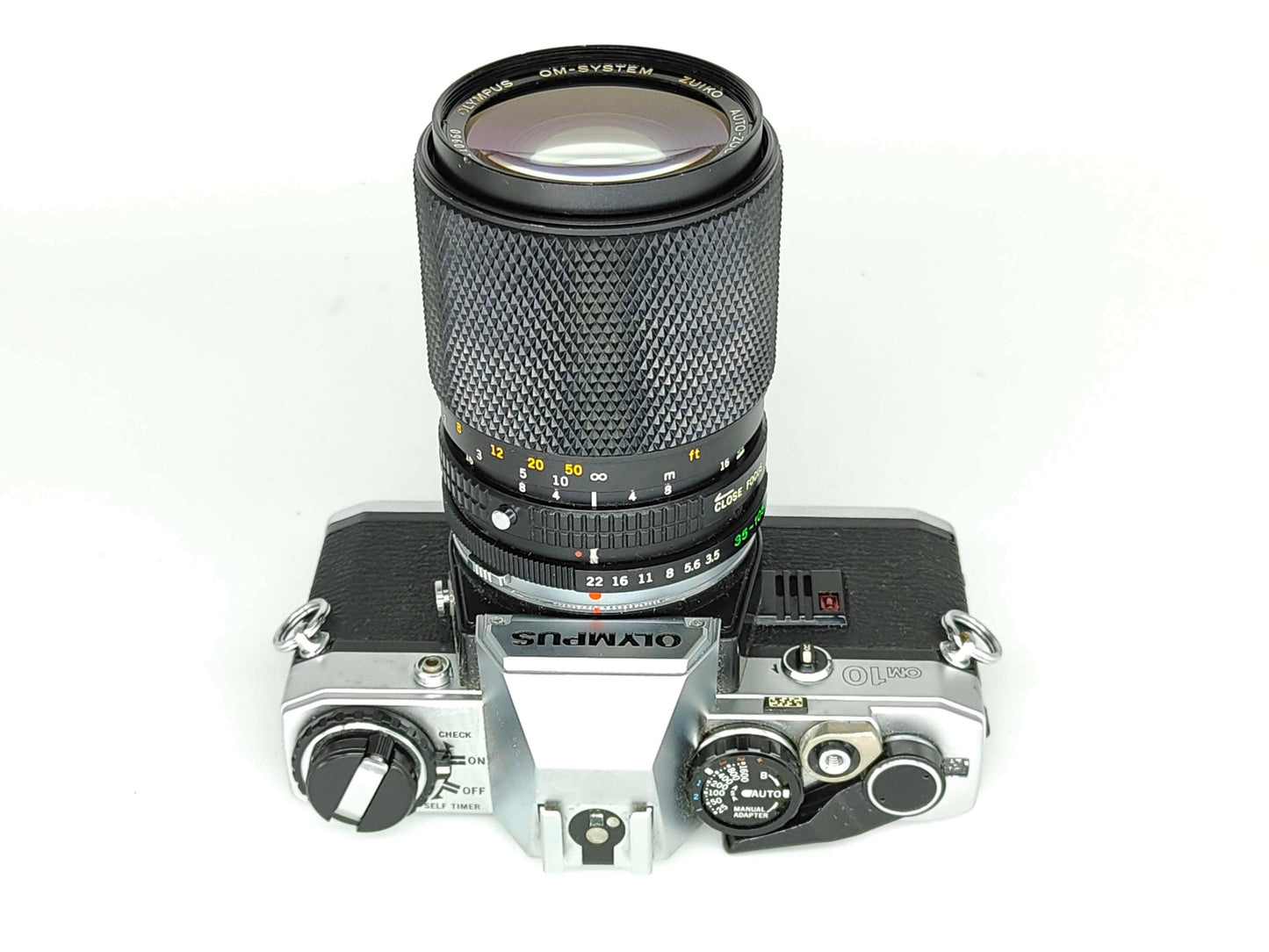 Olympus OM-10 with 35-105mm zoom lens.
