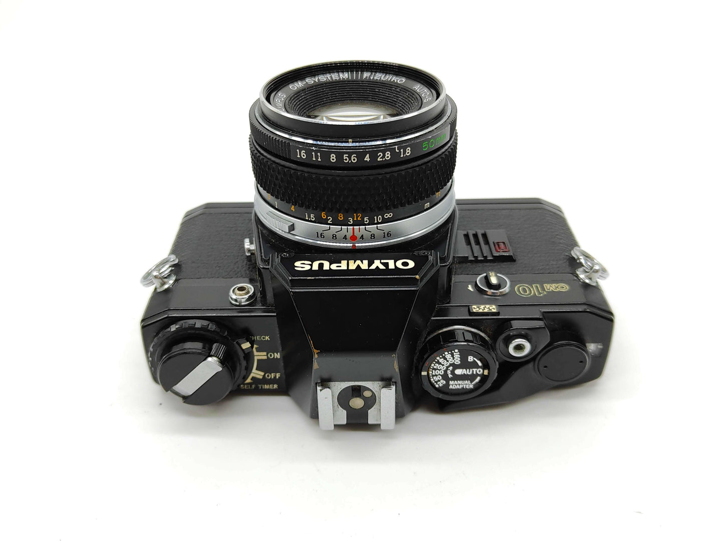 Olympus OM-10 (black) with 50mm f/1.8 lens.