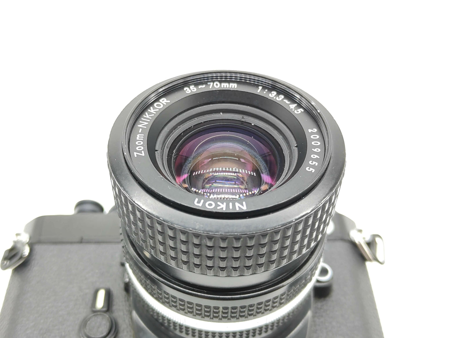 Nikon FE SLR film camera (black) with 36-72mm Nikkor lens.