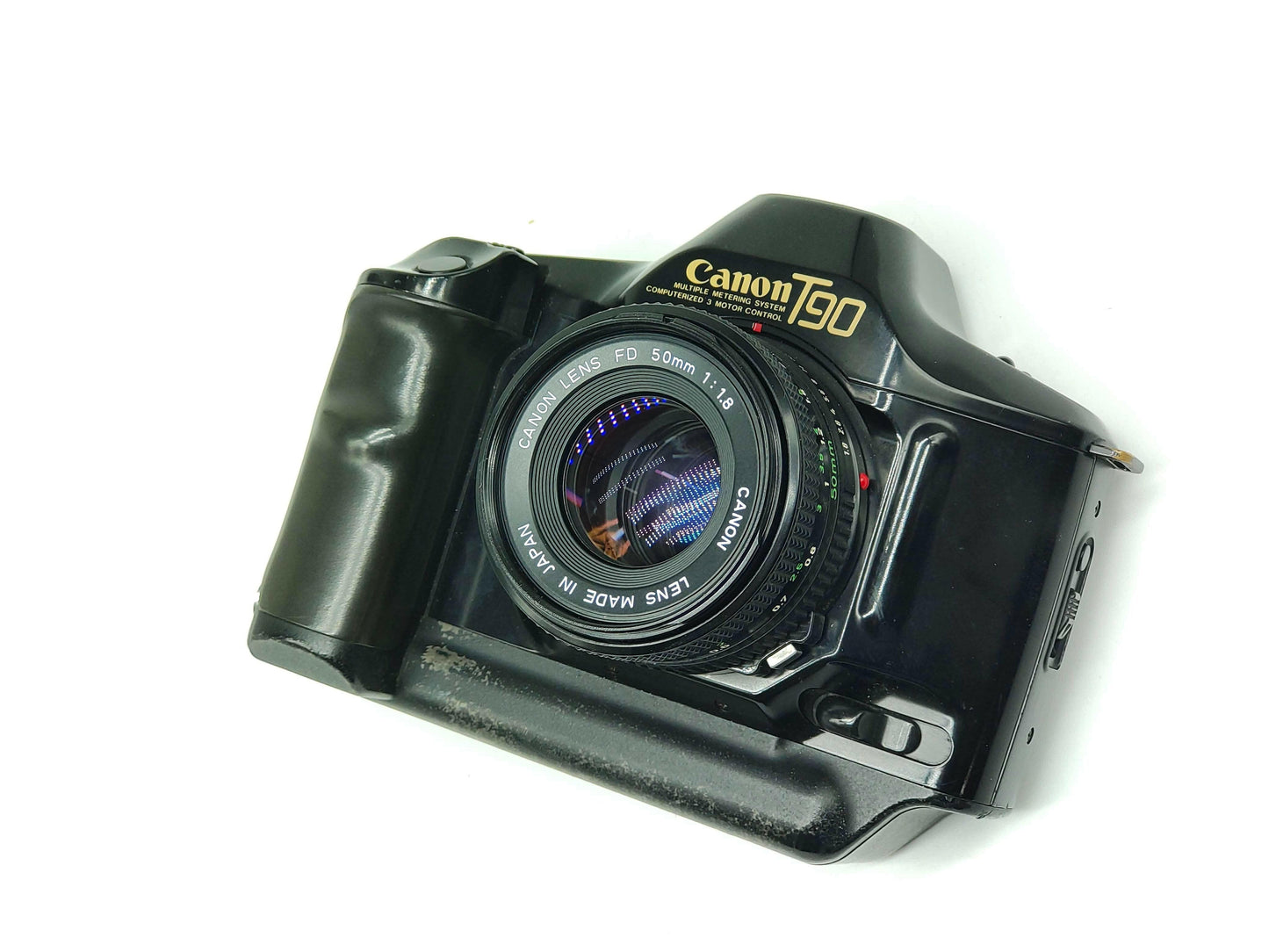 Canon T90 SLR camera + 50mm f/1.8 lens.