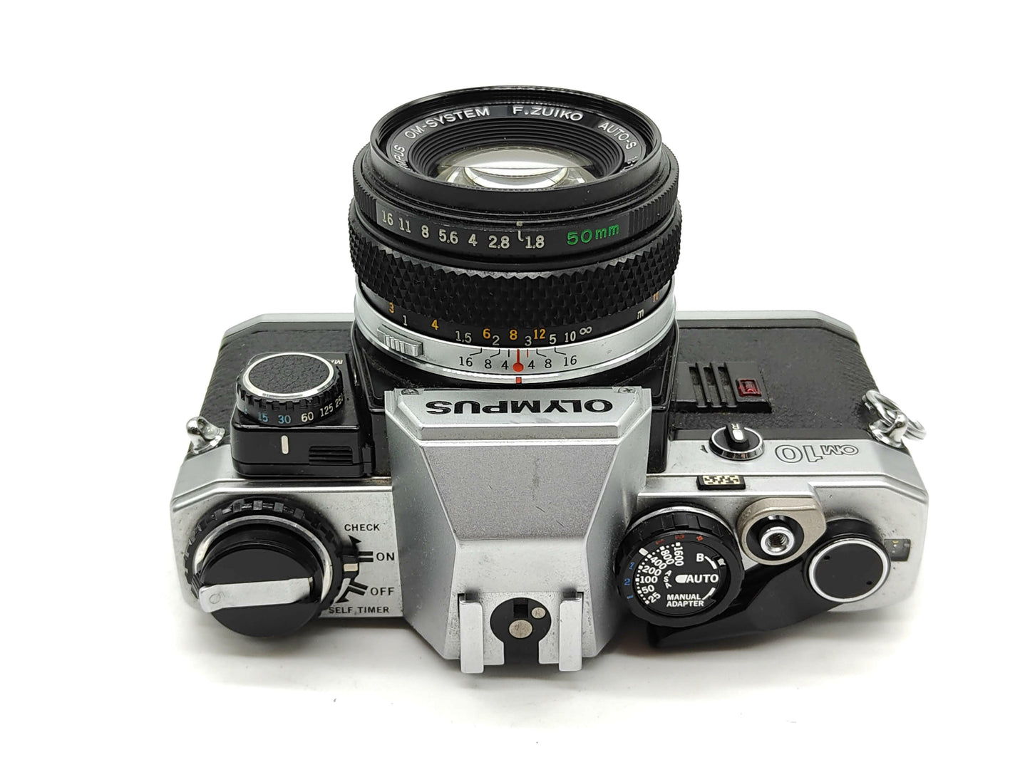 Olympus OM-10 (silver) with 50mm f/1.8 lens + MANUAL ADAPTOR.