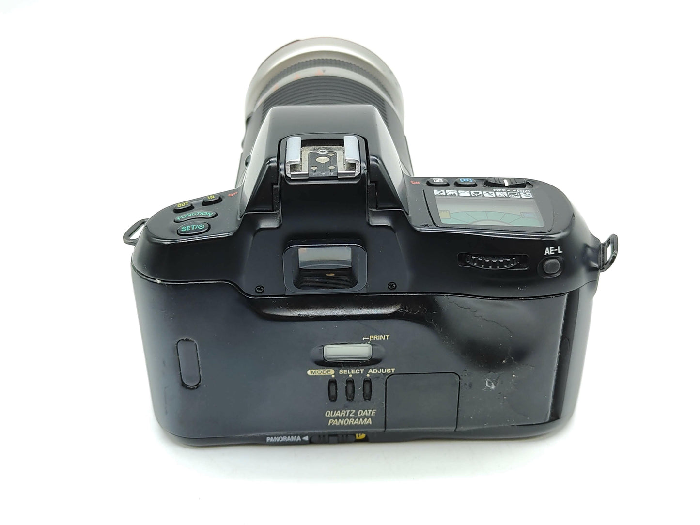 Nikon F70 autofocus film camera with huge zoom lens.