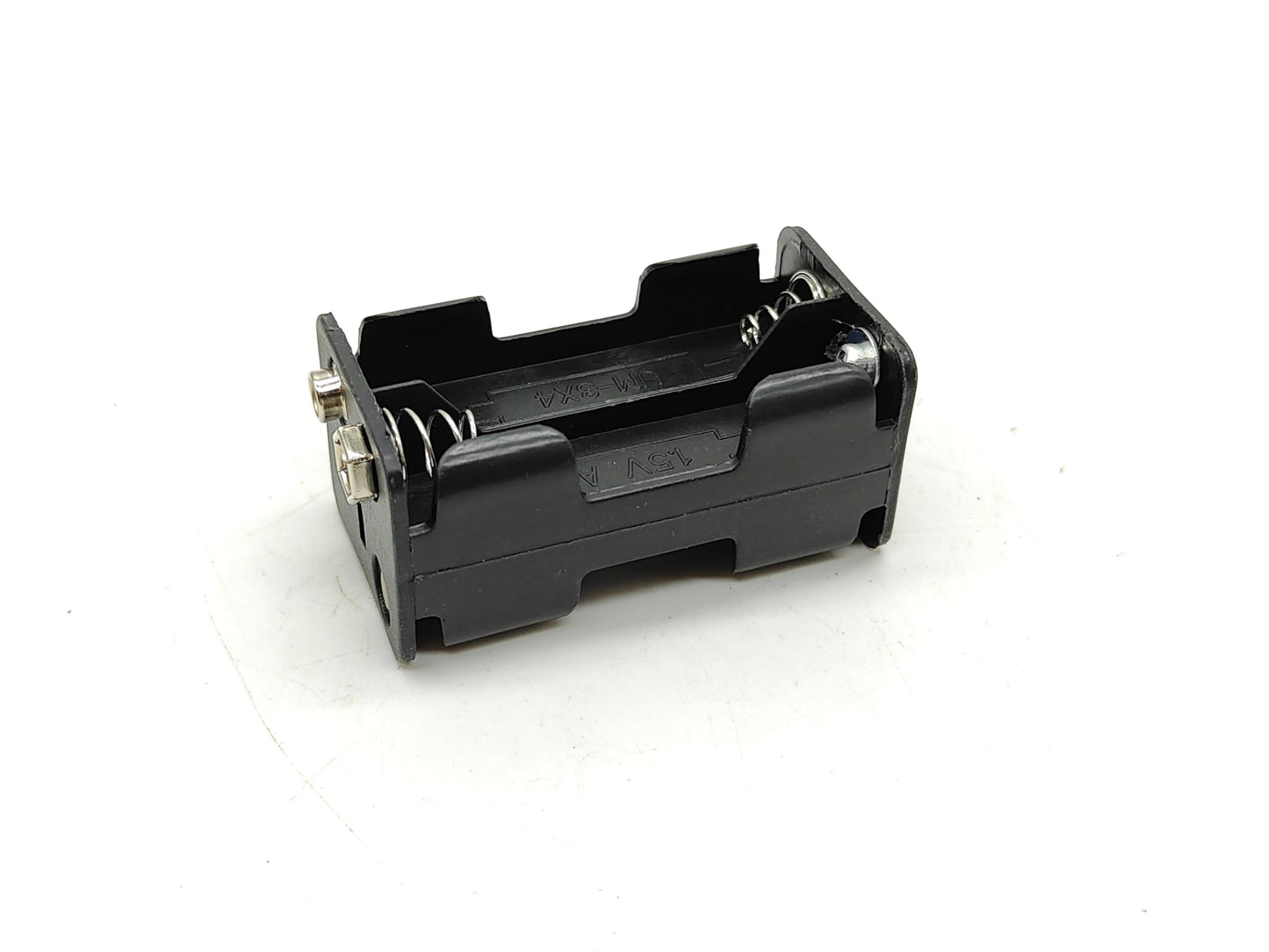Battery holder for Sankyo Super-8 cameras.
