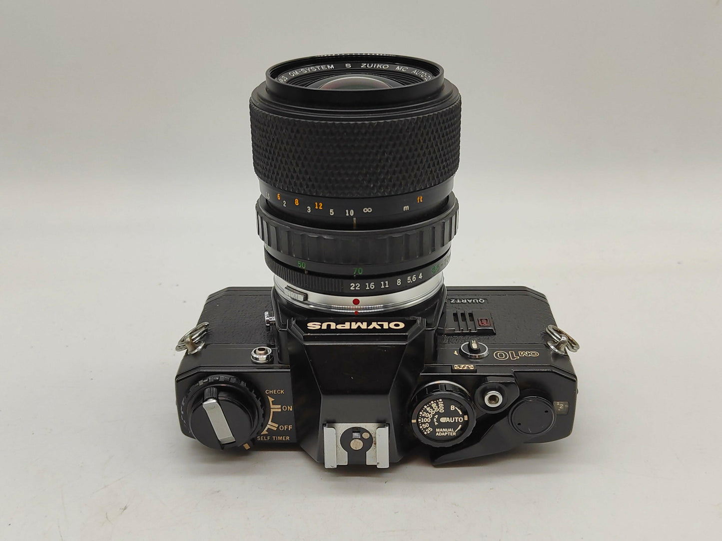 Olympus OM-10 with 35-70mm Olympus Zoom lens.