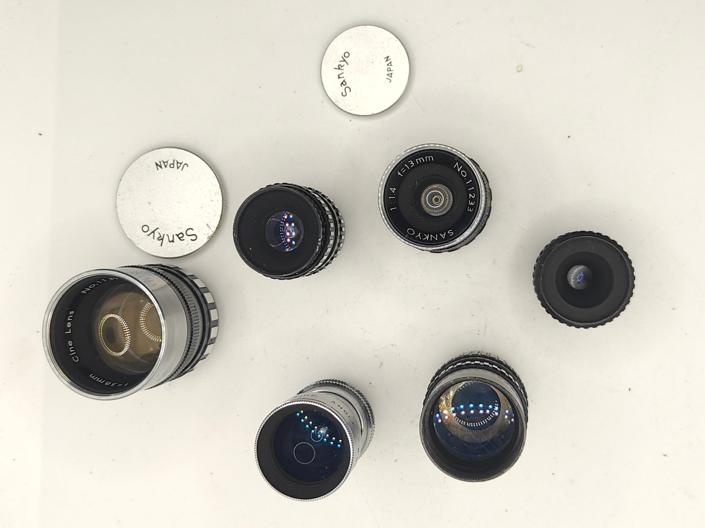 6 D-mount lenses for 8mm cine cameras.