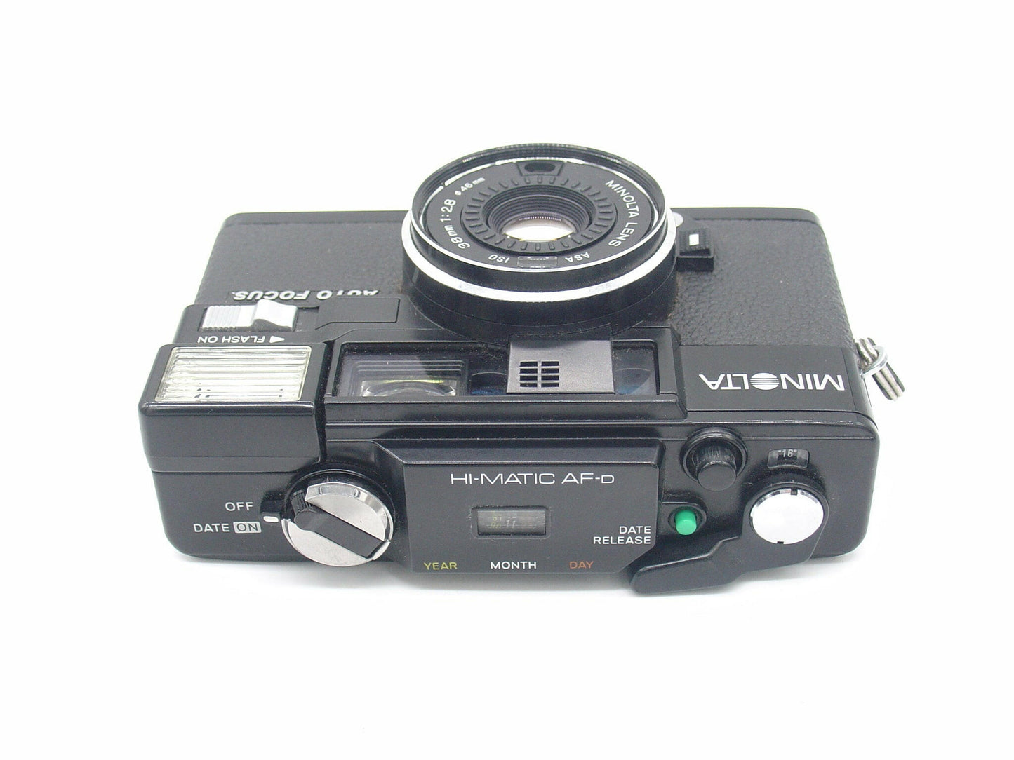 Minolta Hi-Matic AF Date retro point-and-shoot camera.