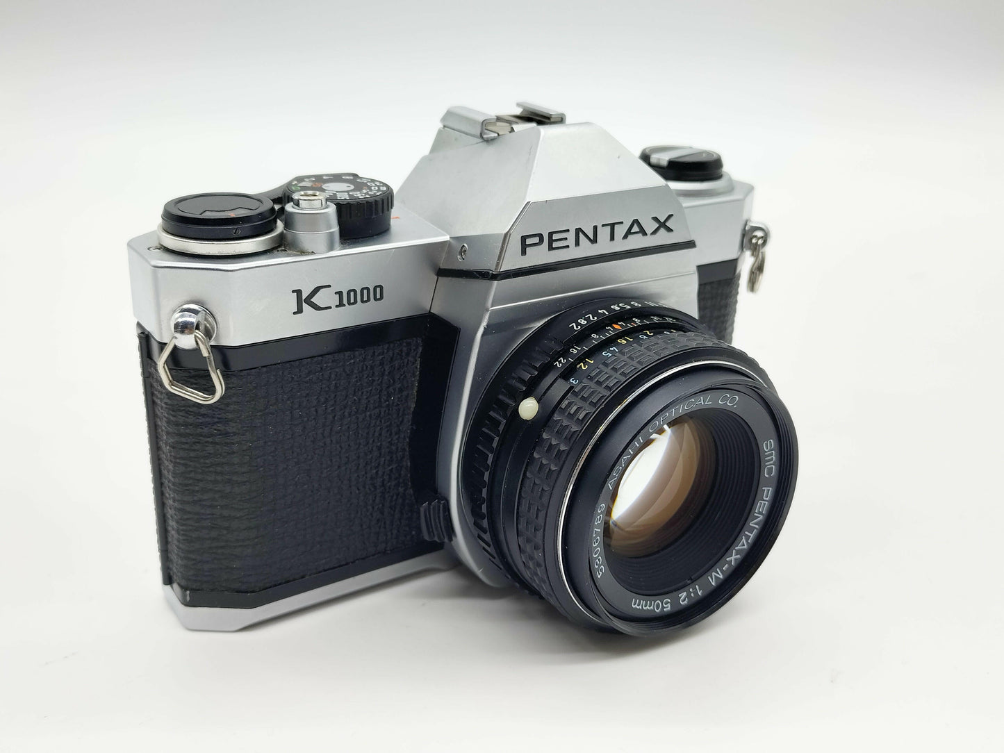 Pentax K1000 SLR film camera with 50mm lens.