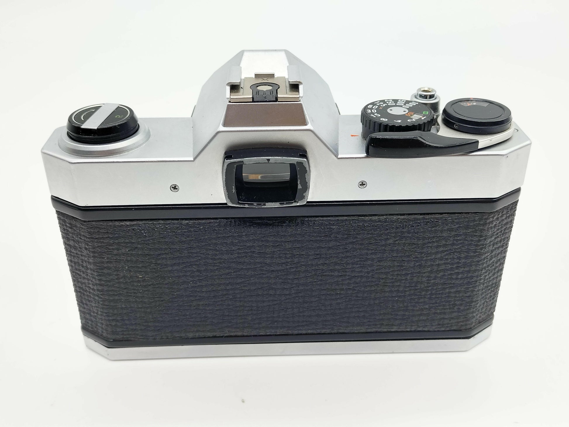 Pentax K1000 SLR film camera with 50mm lens.
