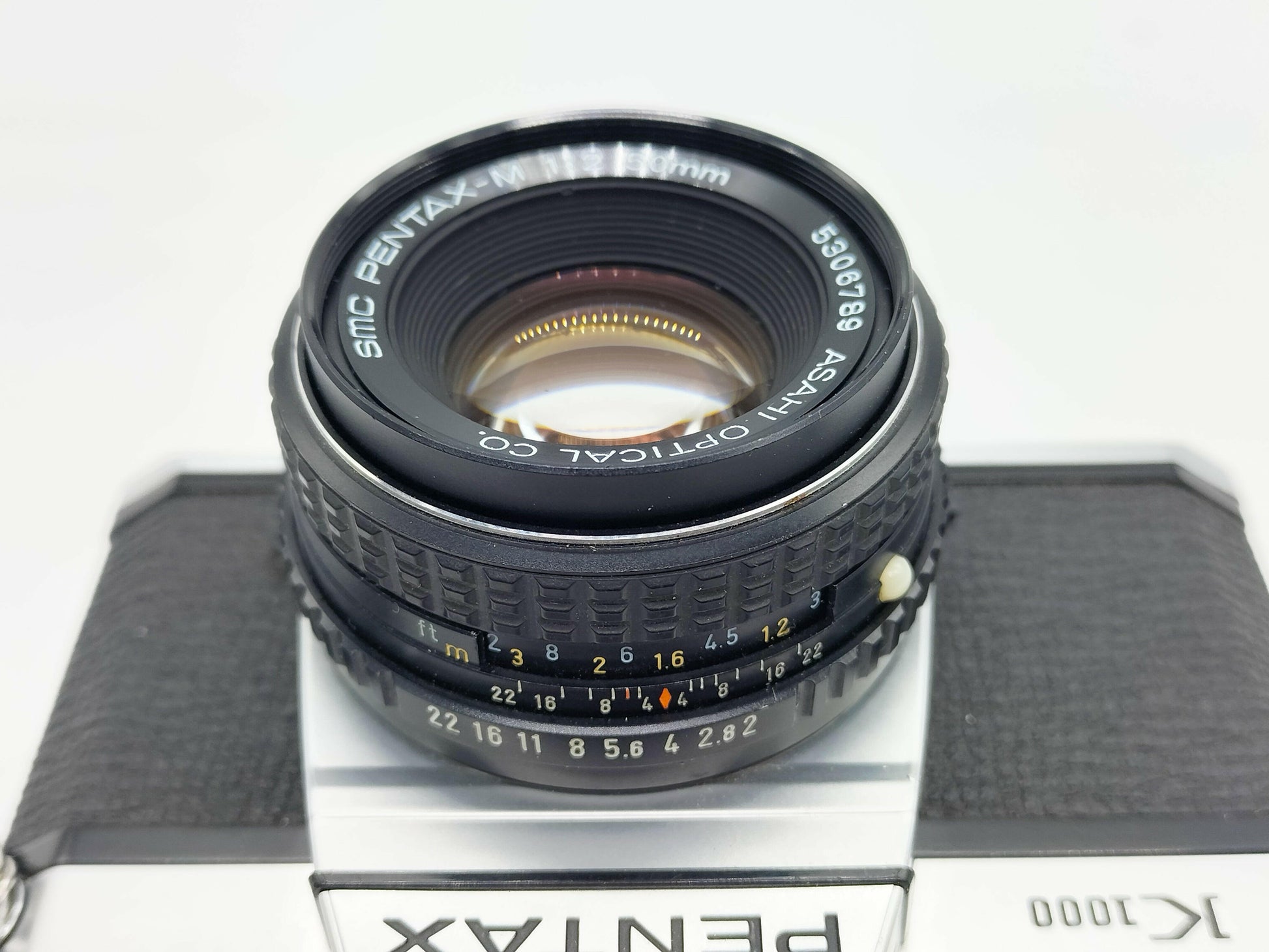 Pentax K1000 SLR film camera with 50mm lens.