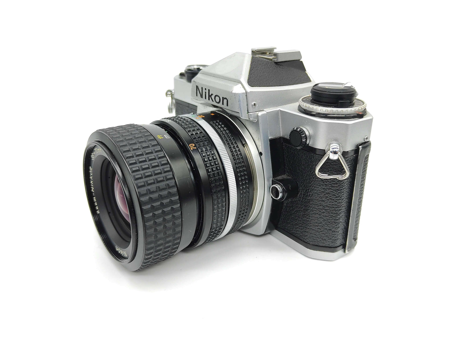 Nikon FE SLR (silver) film camera.