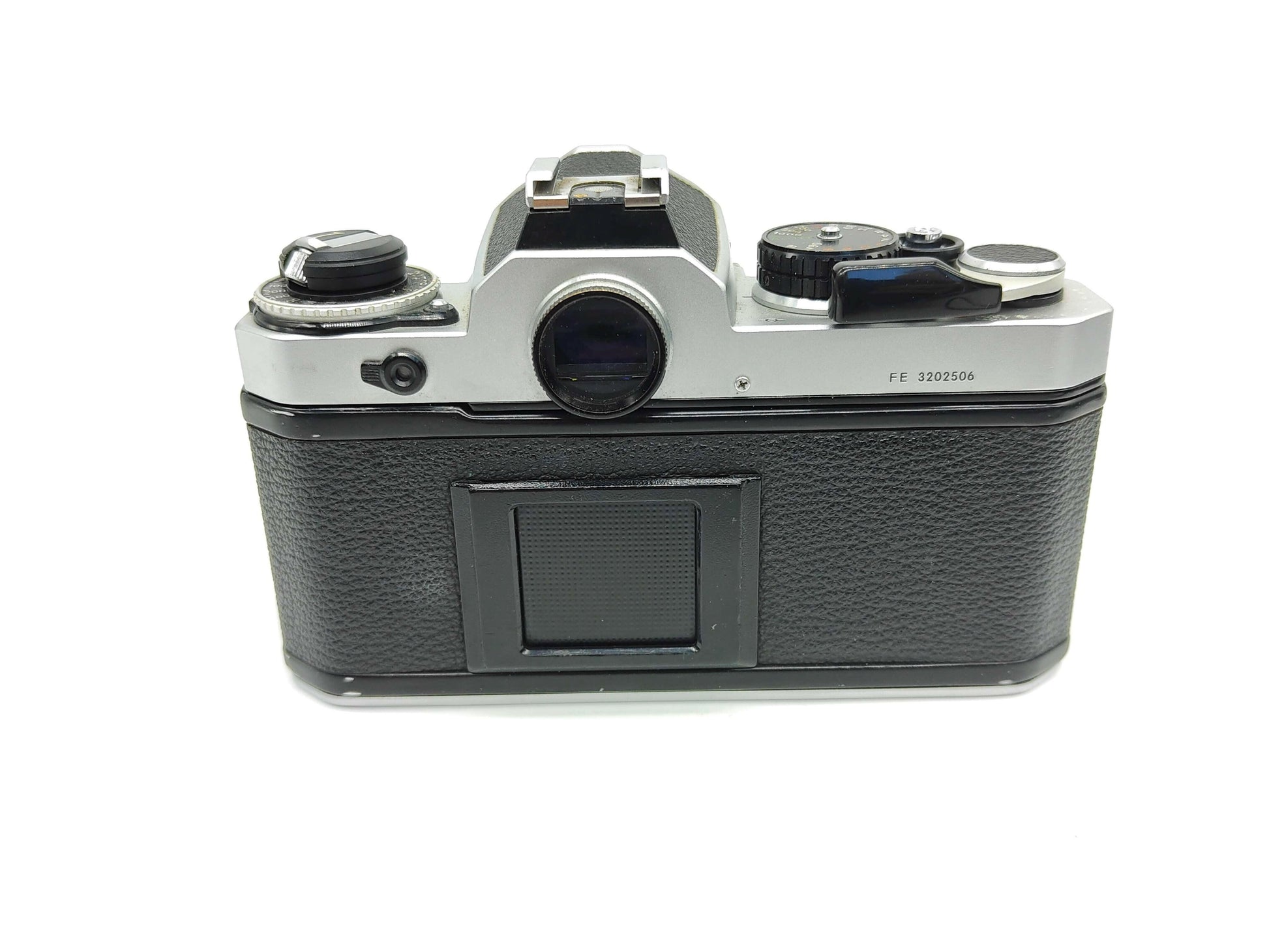 Nikon FE SLR (silver) film camera.