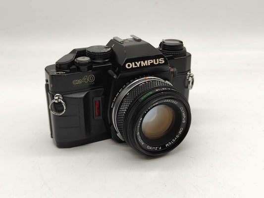 Olympus OM-40 with 50mm f/1.8 lens.