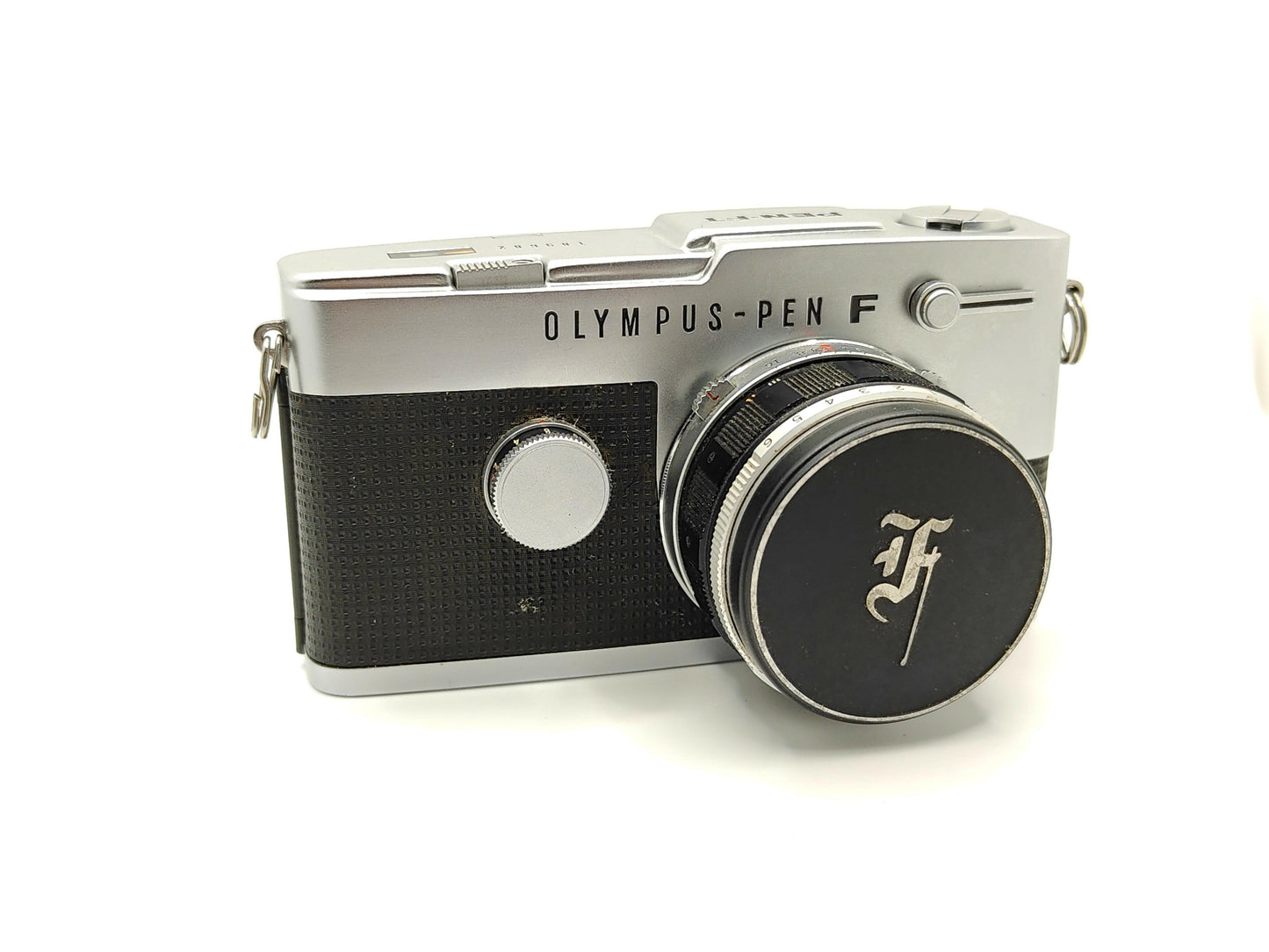 Olympus Pen-FT half-frame SLR camera.