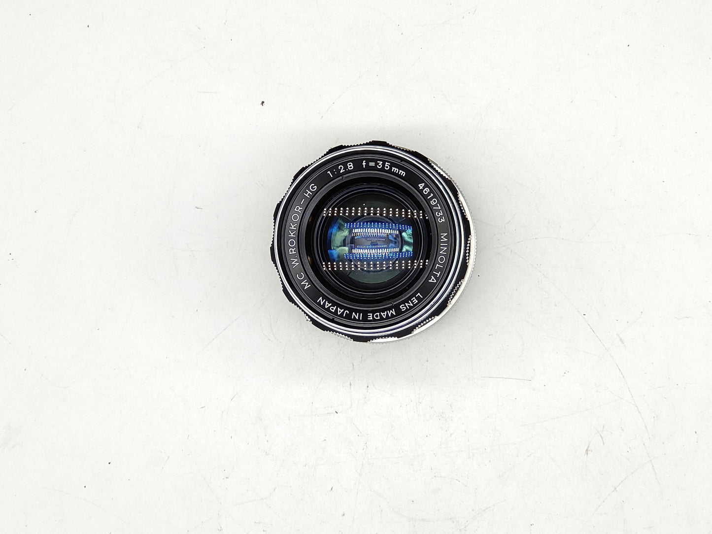 Minolta 35mm f/2.8 wide-angle lens with original lens cap