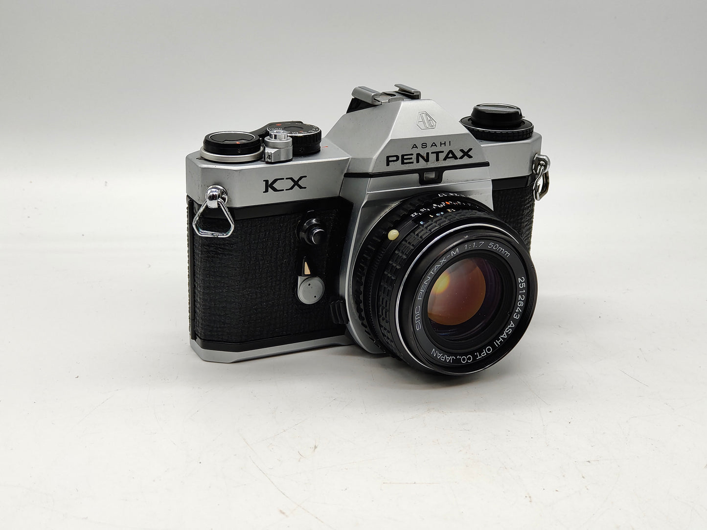 Pentax KX SLR film camera with 50mm f/1.7 lens