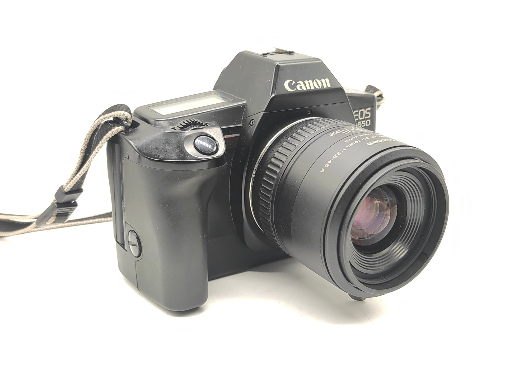 Canon EOS-650 SLR film camera + 35-70mm zoom lens.