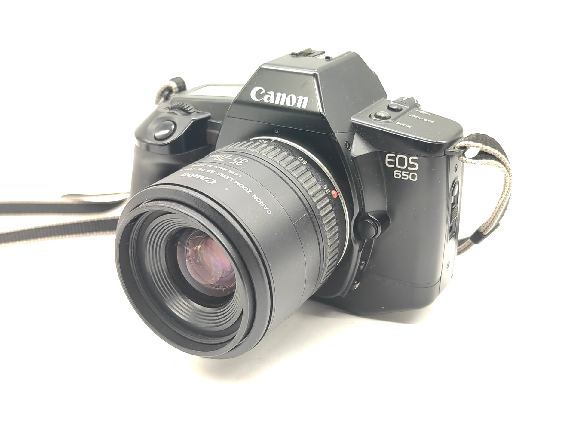 Canon EOS-650 SLR film camera + 35-70mm zoom lens.
