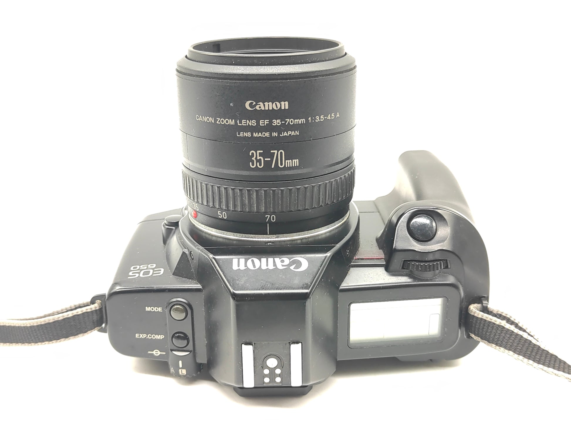 Canon EOS-650 SLR film camera + 35-70mm zoom lens.