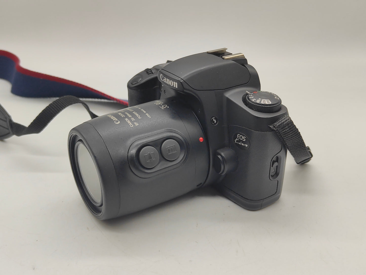 Canon EOS Kiss camera with 35-80mm zoom lens