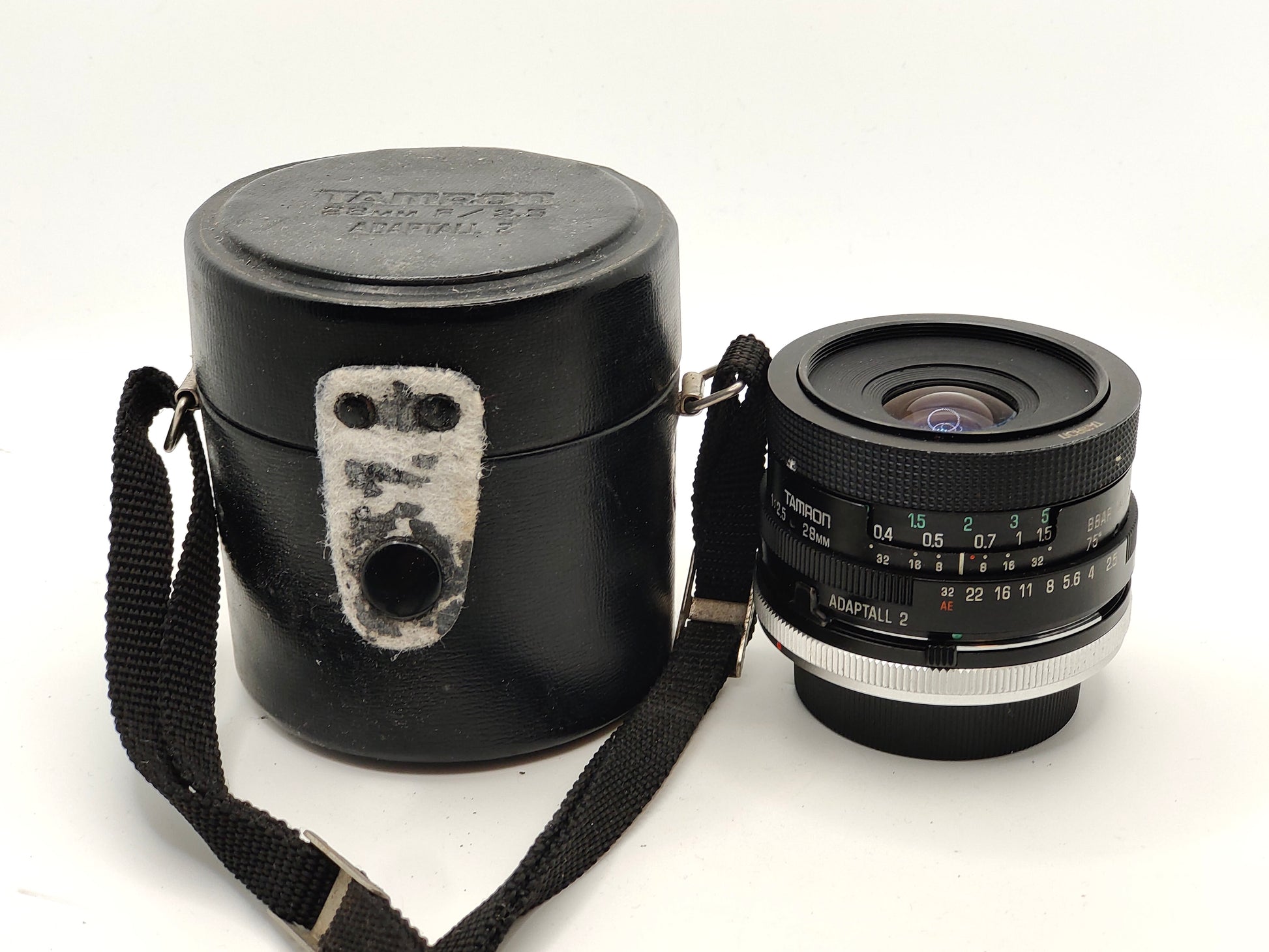 Tamron 28mm f/2.5 wide-angle lens with Canon FD mount.