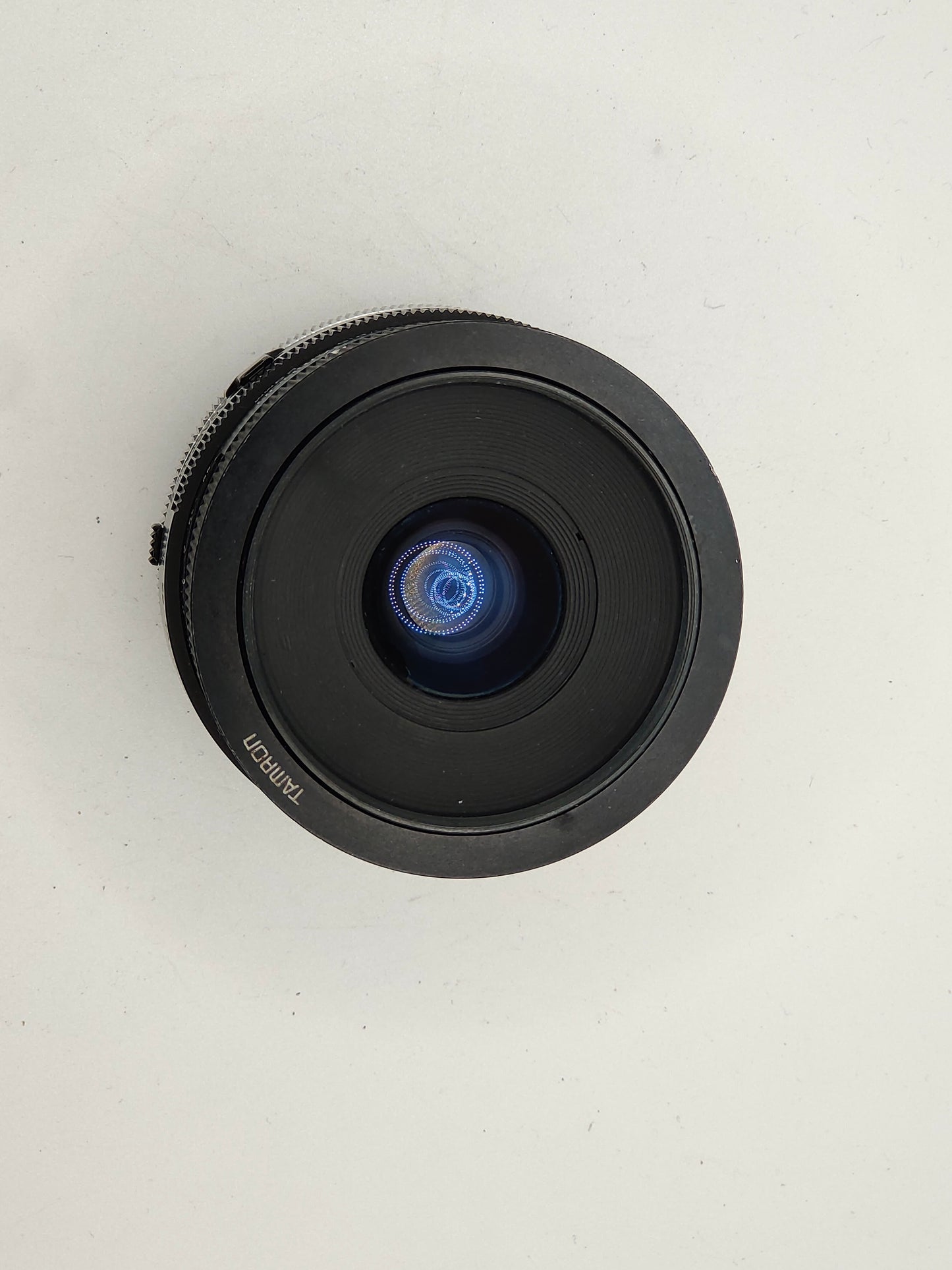 Tamron 28mm f/2.5 wide-angle lens with Canon FD mount.