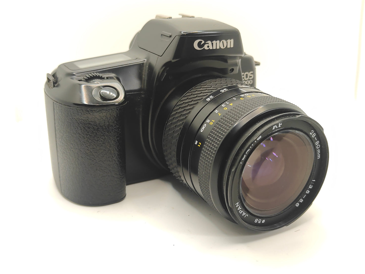 Canon EOS-1000 Quartz Date SLR film camera with zoom lens