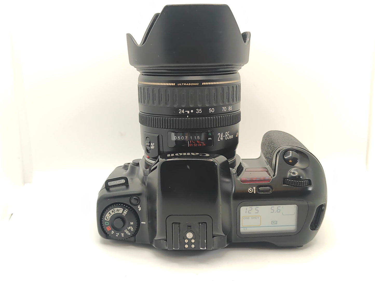 Canon EOS-10 SLR film camera and 24-85mm zoom lens.