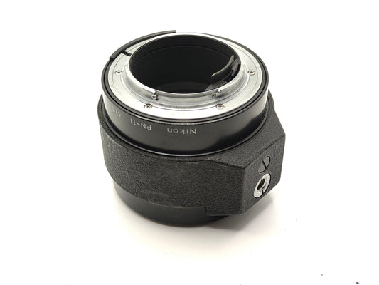 Nikon PN-11 52.5mm Extension Tube (Nikon F mount) with tripod socket.