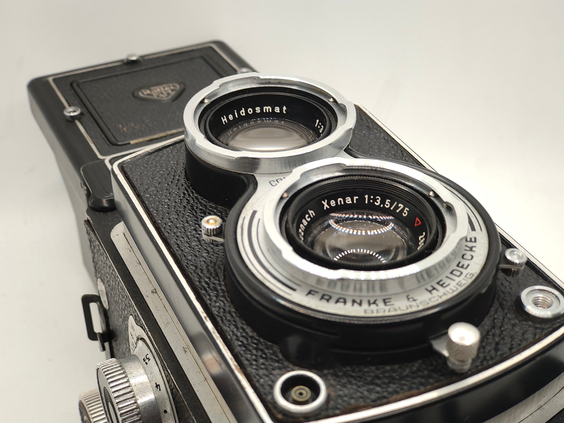 Rolleicord III twin-lens-reflex medium-format camera with leather case.