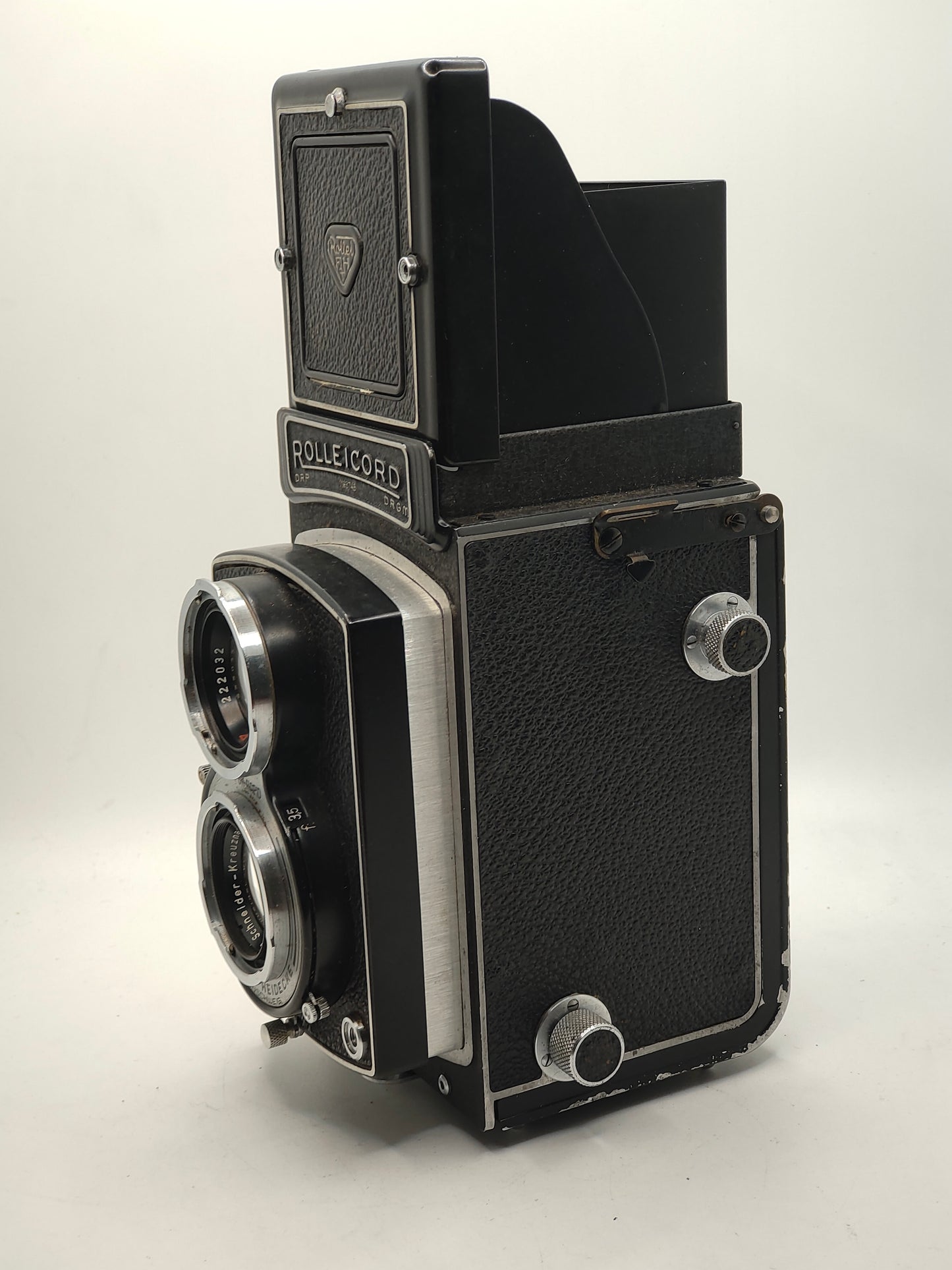 Rolleicord III twin-lens-reflex medium-format camera with leather case.