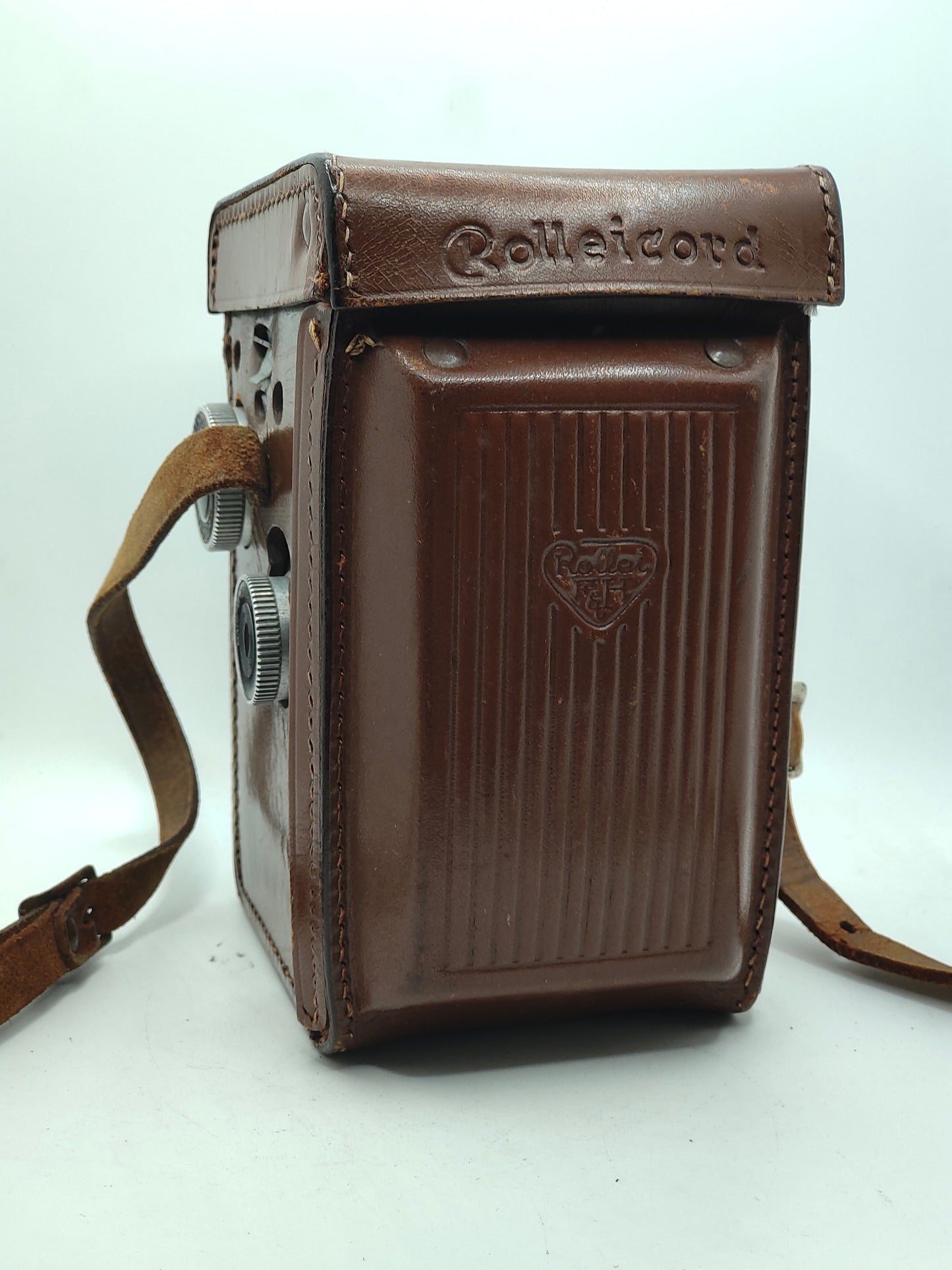 Rolleicord III twin-lens-reflex medium-format camera with leather case.
