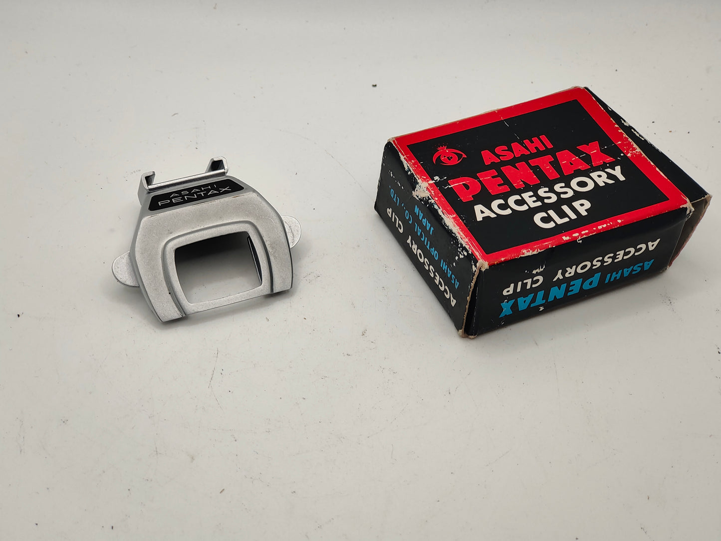 Clip-on flash / accessory shoe for Pentax SV SLR camera.