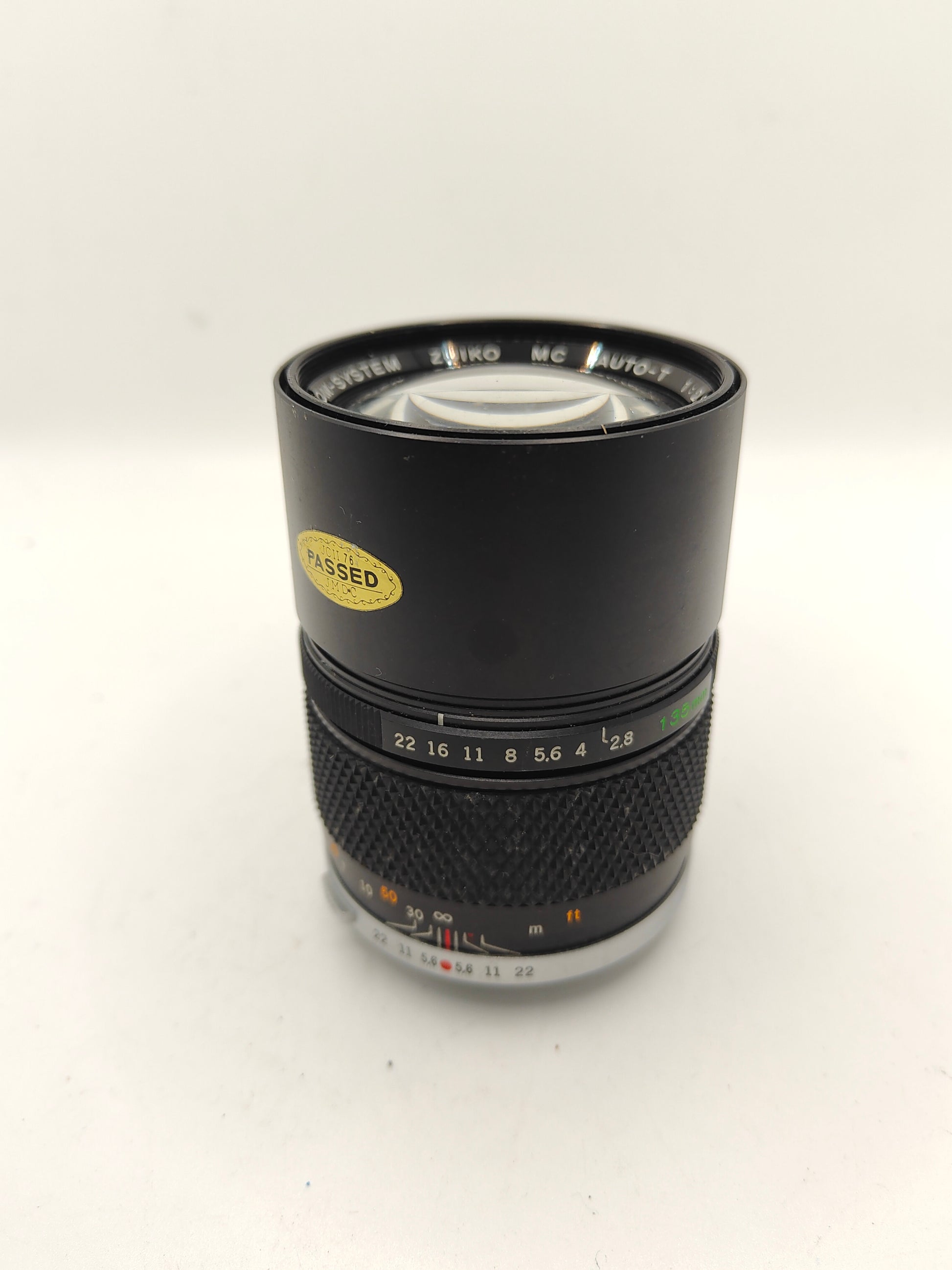 Olympus Zuiko 135mm f/2.8 lens in fair condition.
