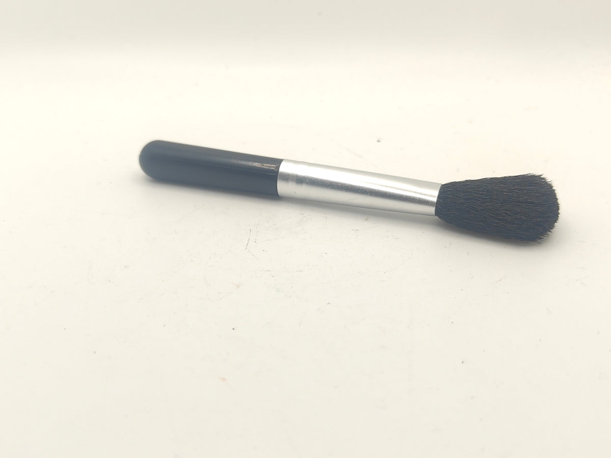 Lens cleaning brush.
