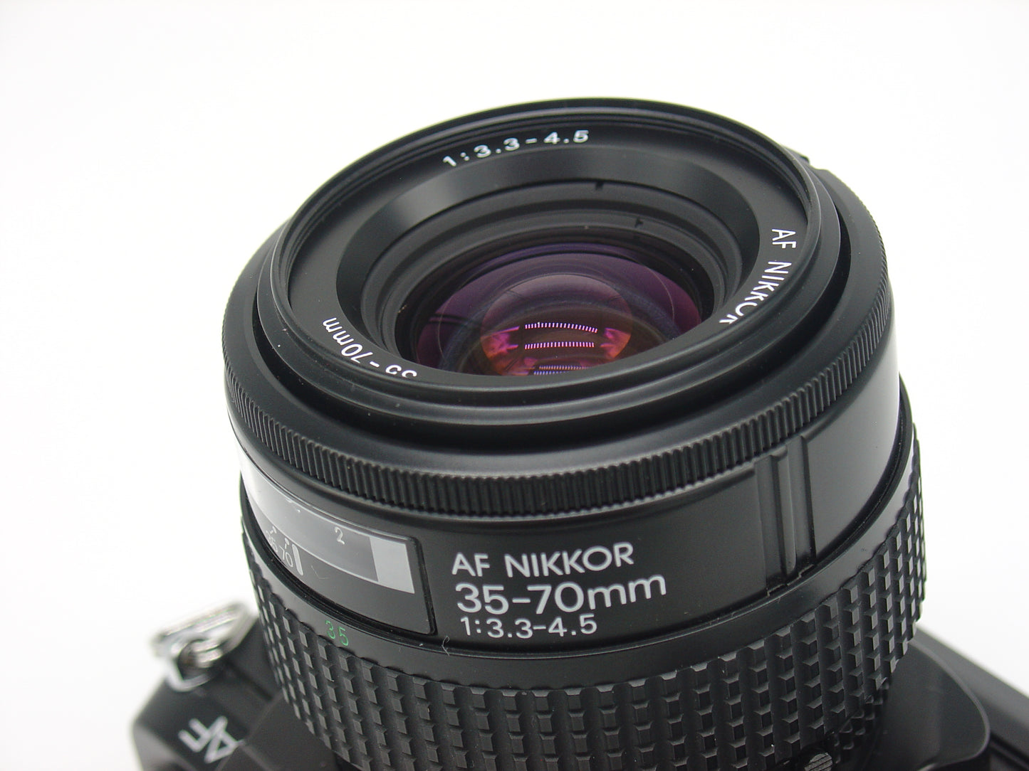 Nikon F-501 SLR film camera with zoom lens